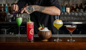 An image of a mixologist making a cocktail