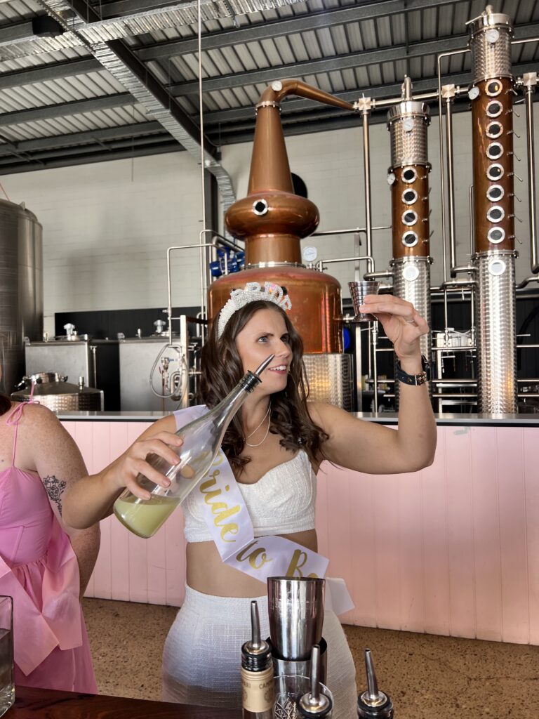 bride measuring cocktail ingredients