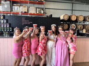 group of girls posing with cocktails
