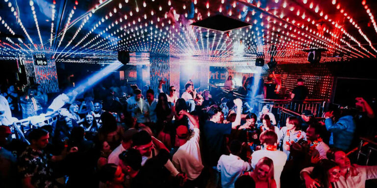 an image of a night club dancefloor and dj