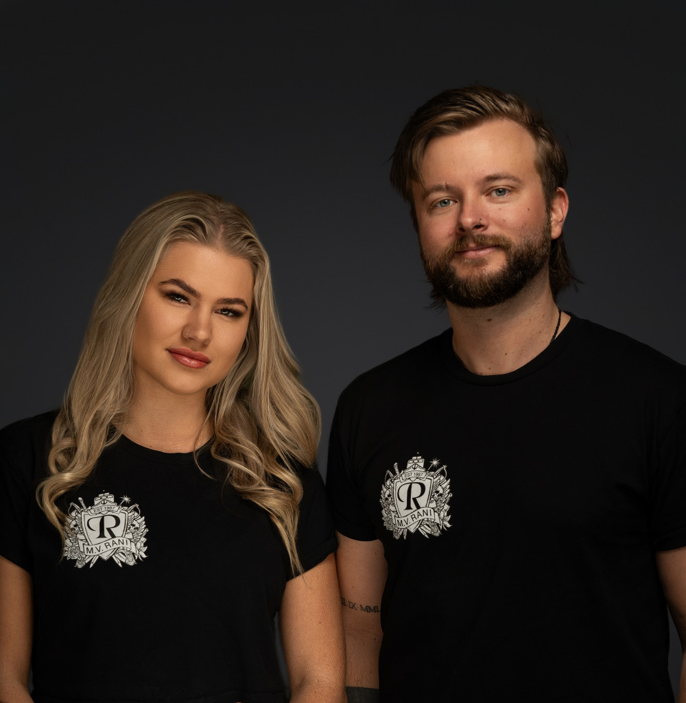 Sash and Luke of Rani Events standing together.