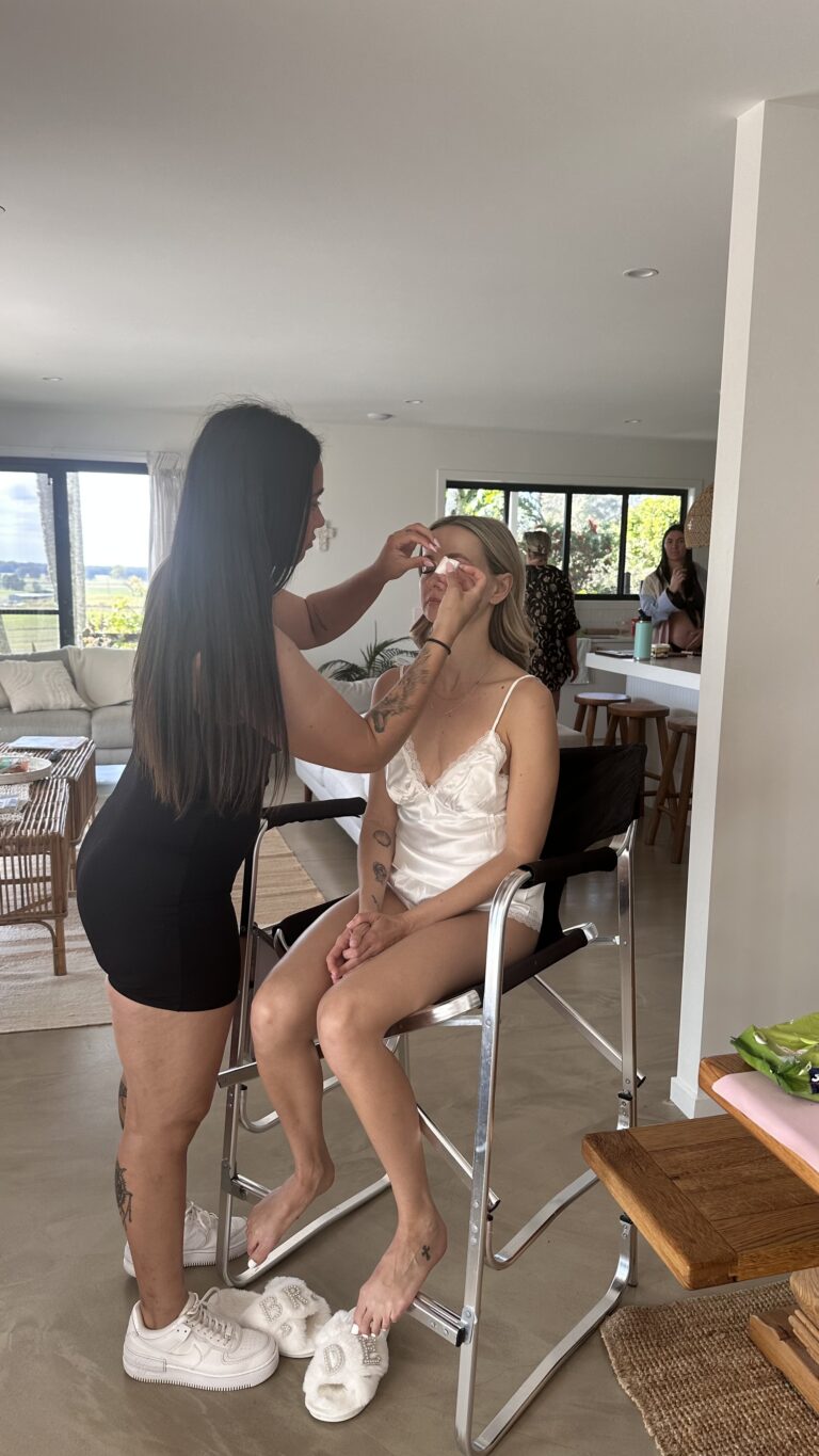 bride having her makeup done by an artist