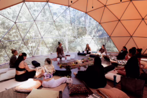 Group of hens party doing breathwork meditation