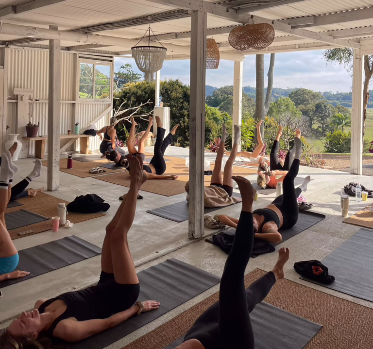Group of girls laying down doing yoga